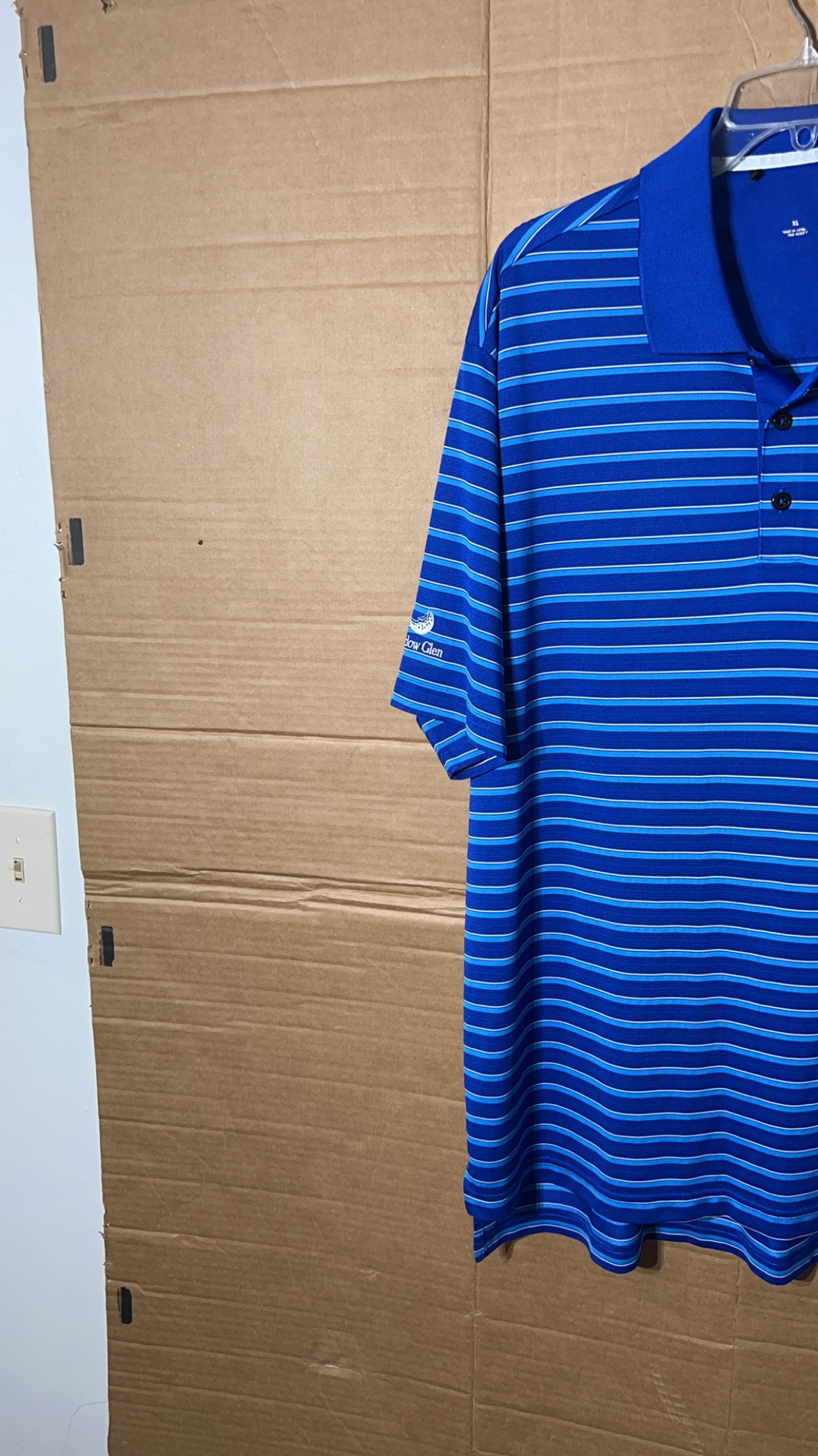 Adidas men’s blue polo shirt.