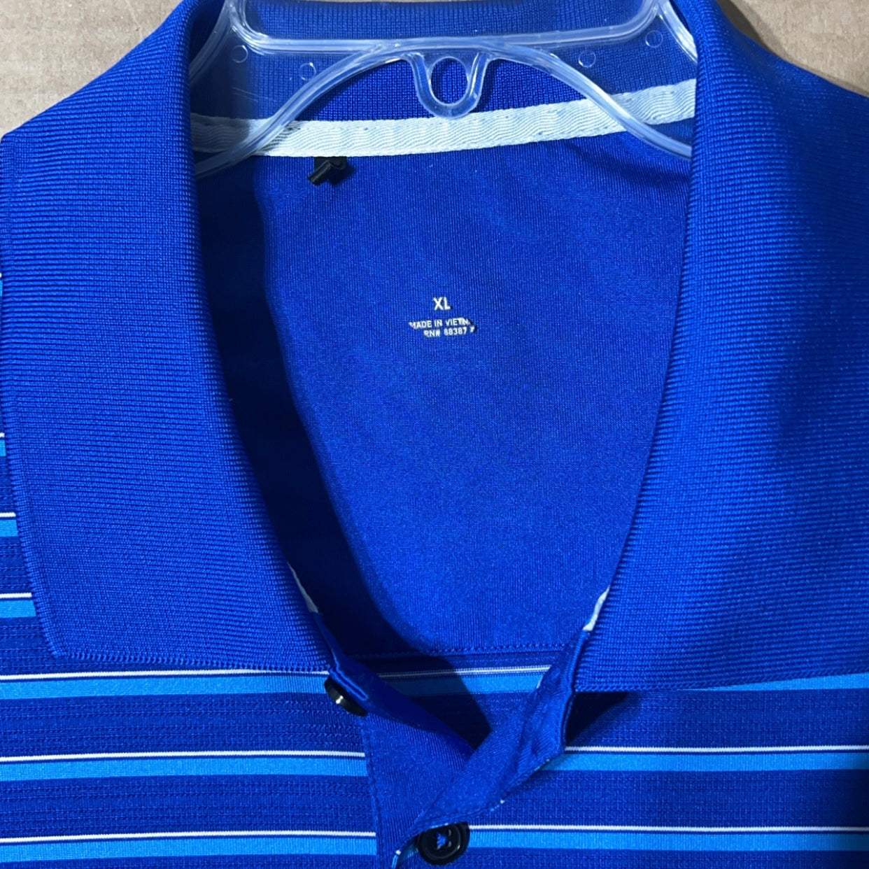 Adidas men’s blue polo shirt.